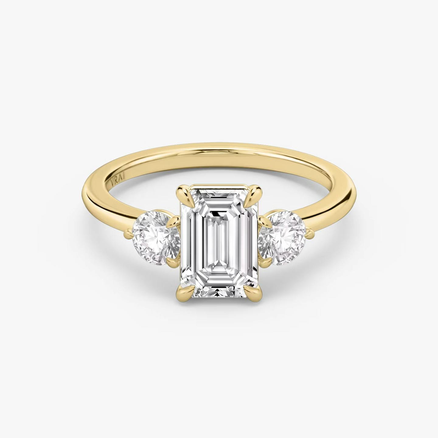 The Three Stone | Emerald | 18k | 18k Yellow Gold | Band: Plain | Side stone carat: 1/4 | Side stone shape: Round Brilliant | Diamond orientation: vertical | Carat weight: See full inventory